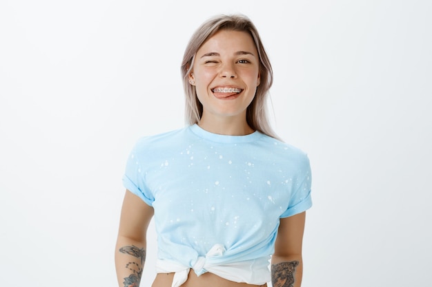 carefree blonde girl posing in the studio