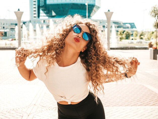 Carefree girl posing in the street