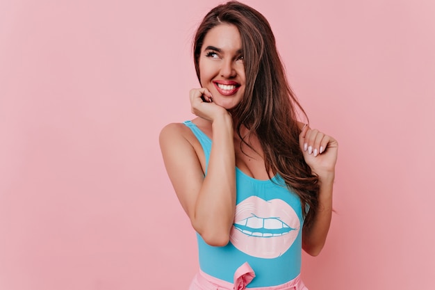 Carefree girl with long hairstyle looking away with smile