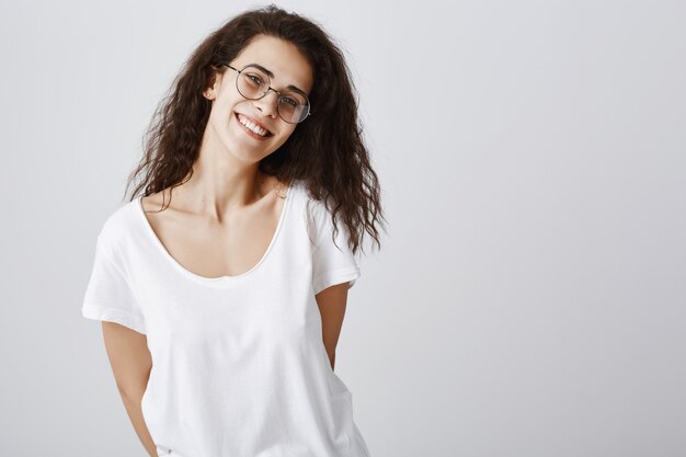 Carefree smiling woman in glasses looking happy
