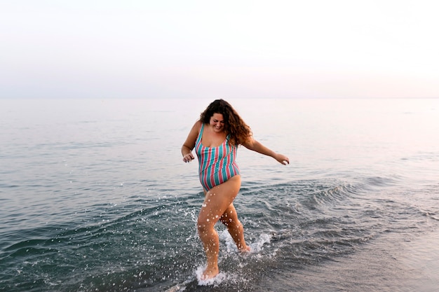 Carefree woman by the beach