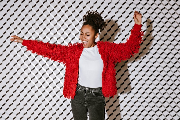 Free photo carefree woman waving hands with smile