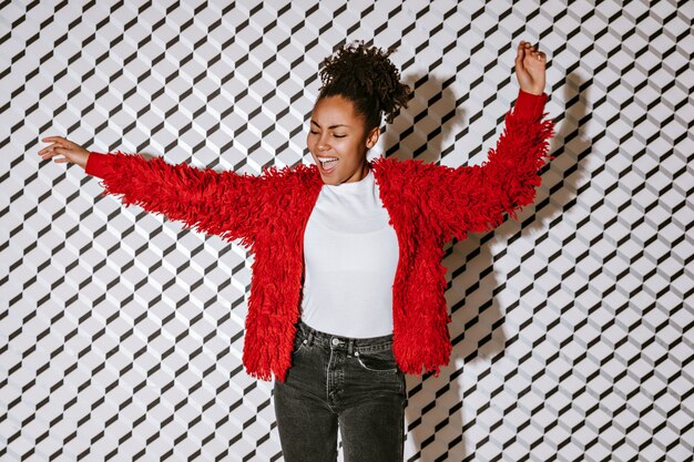 Carefree woman waving hands with smile