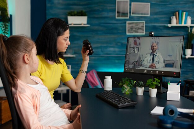 Carefully mother discussing healthcare treatment against kid disease