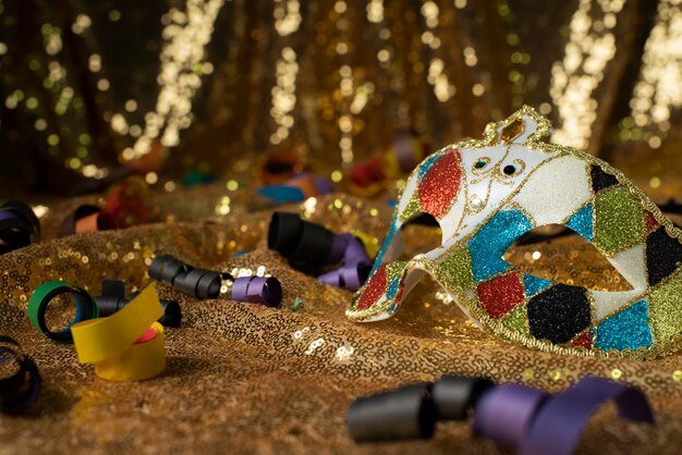Carnival mask surrounded by confetti