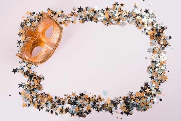 Carnival mask with small spangles on table