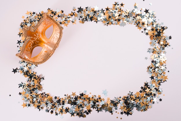 Carnival mask with small spangles on table