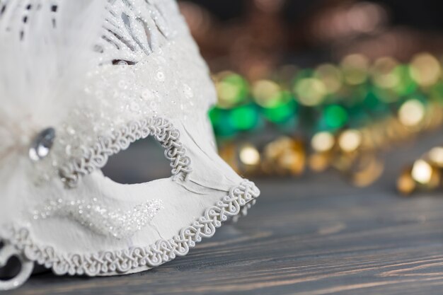 Carnival mask on wooden table