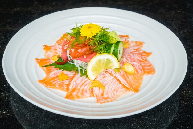 Carpaccio salmon in white plate