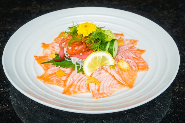 Carpaccio salmon in white plate