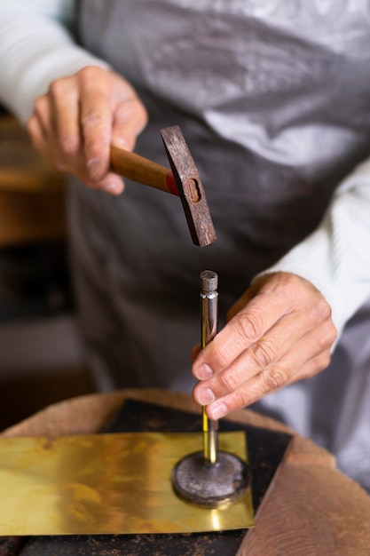 Carpenter hammering a nail