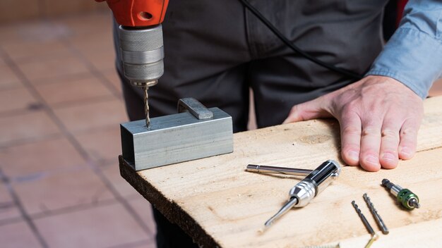 Carpenter in the process of making a wooden table