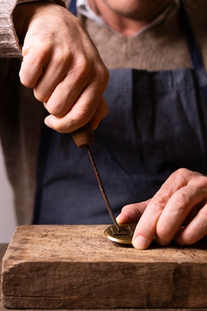 Carpenter using a screwdriver on wood