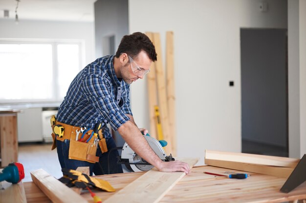 Carpenter working in a house