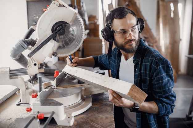 Carpenter working with circular saw