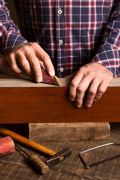 Carpenter working on wood front view