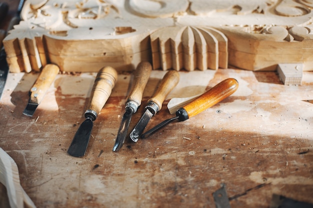 The carpenter works with a tree