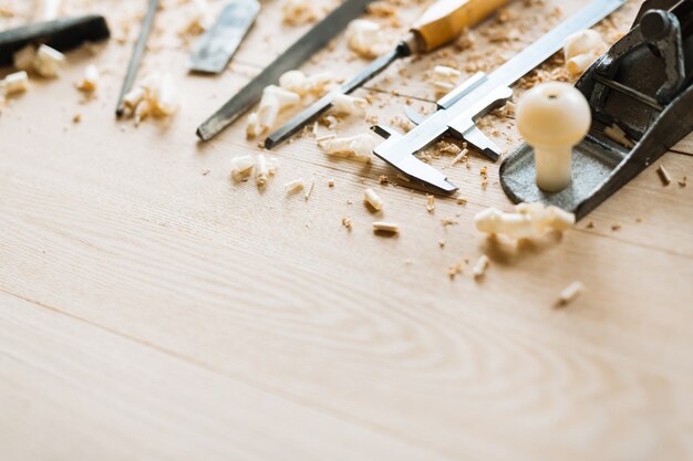 Carpentry tools on wooden table background