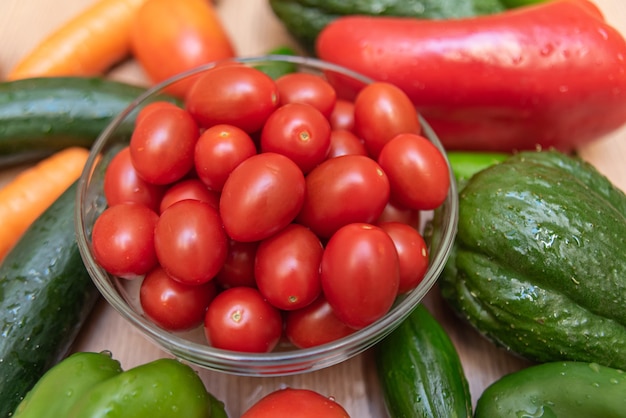 Carrot, cucumber, chayote, tomato and peppers on the table