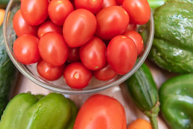 Carrot, cucumber, chayote, tomato and peppers on the table