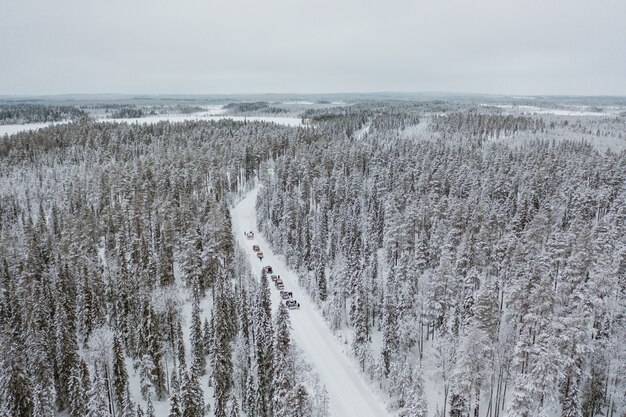 Cars driving through a mesmerizing snowy scenery in Finland