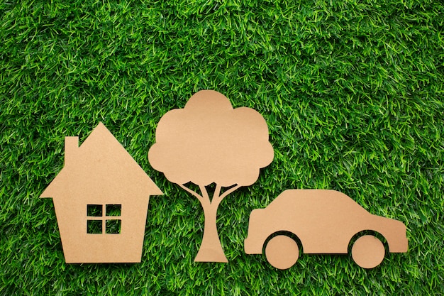 Free photo cartoon car house and tree in grass