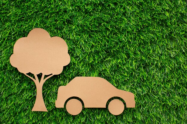 Cartoon car and tree in grass