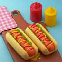 Free photo cartoon style hot dogs and sauces