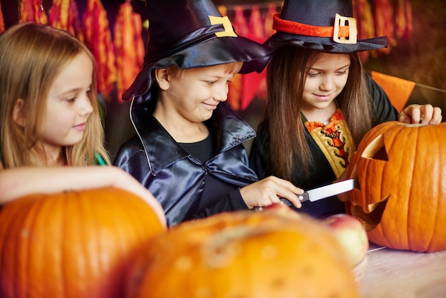 Carving a pumpkin demands great focus