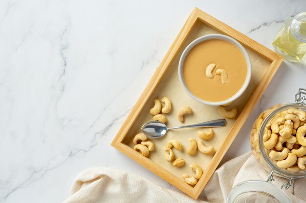 Cashew butter on marble background