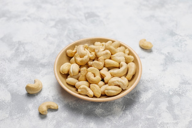 Cashew nuts in ceramic plates.top view