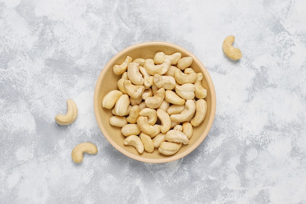 Cashew nuts in ceramic plates.top view