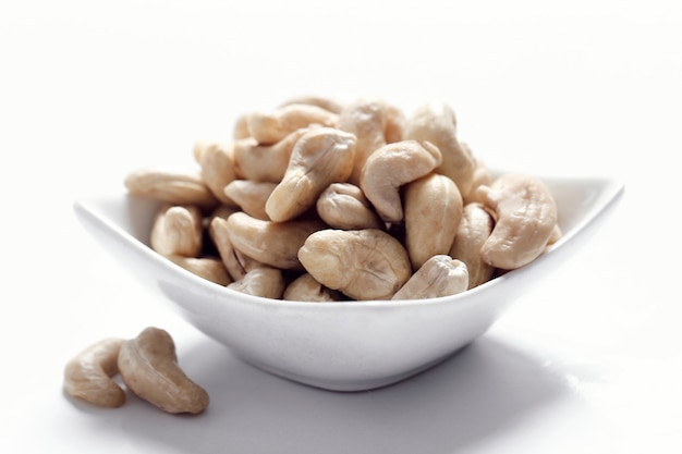 Cashews on white bowl