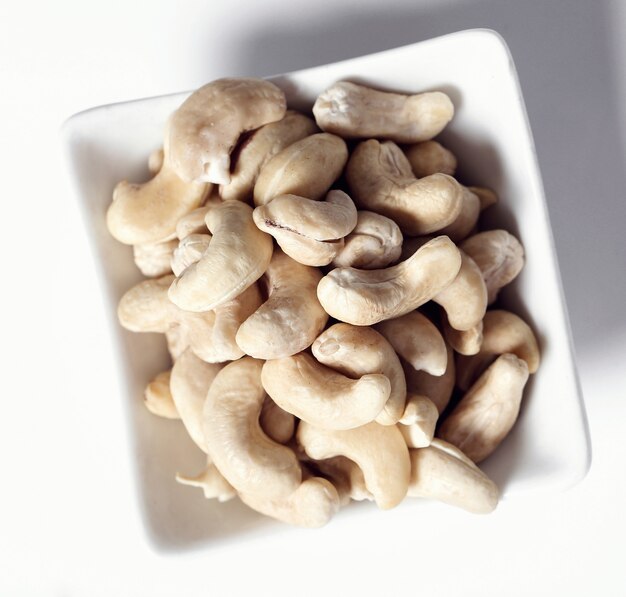 Cashews on white bowl