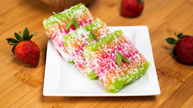 Cassava layer rainbow is made from steamed cassava with colorants food and and fresh grated coconut