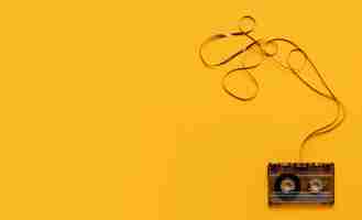 Free photo cassette tape on yellow background