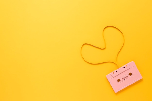 Cassette on yellow background with copy space