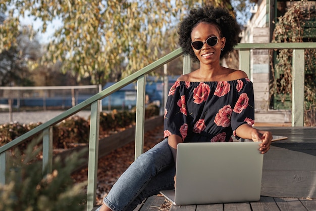 Casual african woman working outdoors