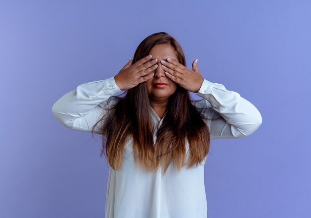 Casual caucasian middle-aged woman covered eyes with hands 