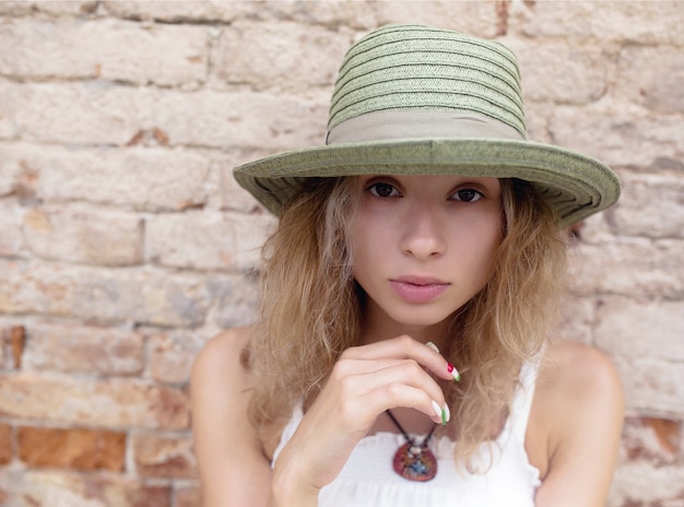 Free photo casual couple serene holding hat