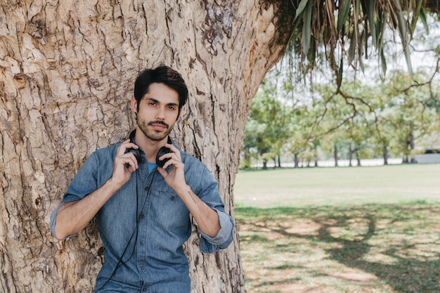 Casual man posing in earphones