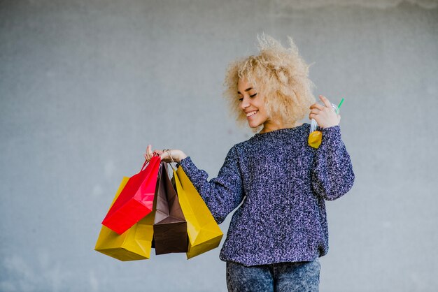 Casual pretty girl with shopping bags