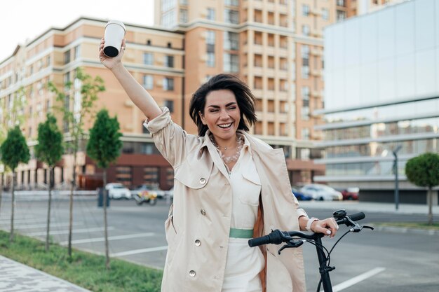 Casual woman waving at friends outdoors