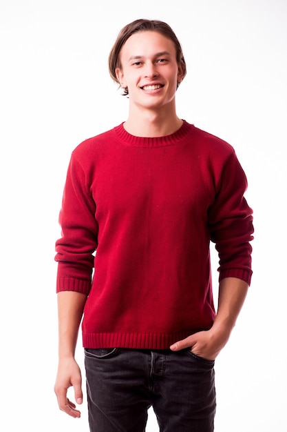 Casually handsome. Confident young handsome man while standing against white wall