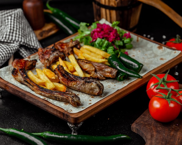 Caucasian barbecue with french fries in lavash bread.