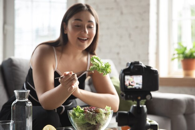 Caucasian blogger makes vlog how to diet and lost weight
