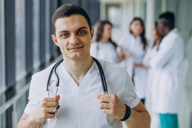 Caucasian doctor man standing in the corridor of the hospital