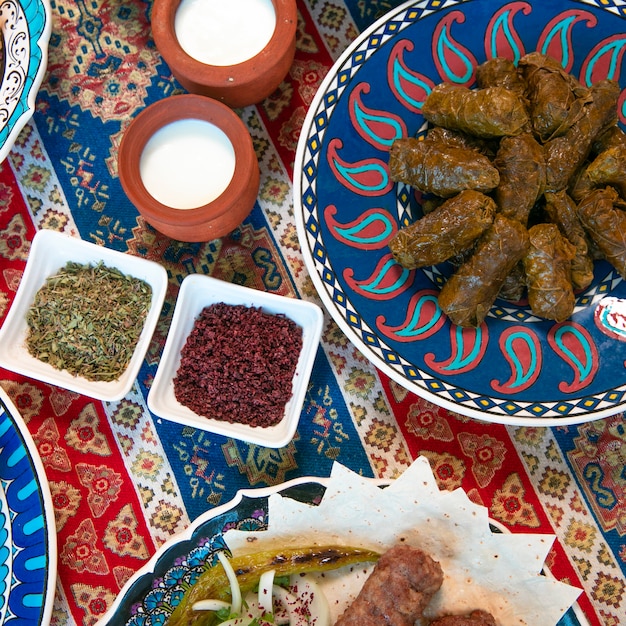 Free photo caucasian dolma served with yogurt and spices