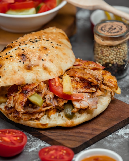 Caucasian doner with vegetables in bread.