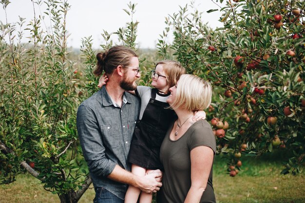 A Caucasian family is spending time at the farm together